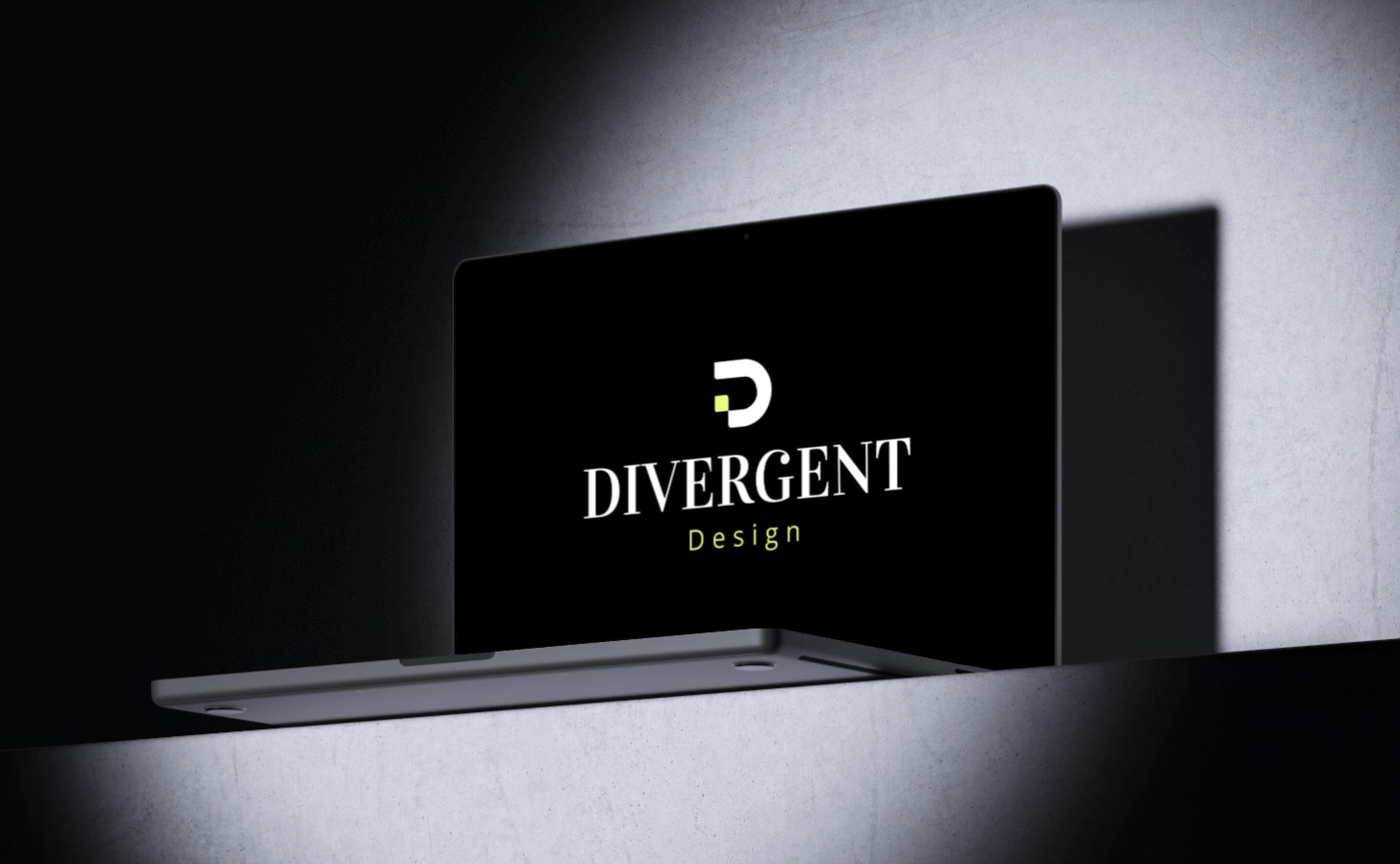Divergent logo on a black laptop screen, brand identity design by Donika Bajrami.
